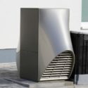 Sleek silver air conditioning unit for outdoor use, featured in Carmine's Plumbing services.